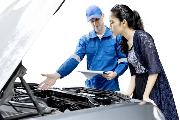 Male mechanic shows trouble car machine on studio — Stock Photo, Image