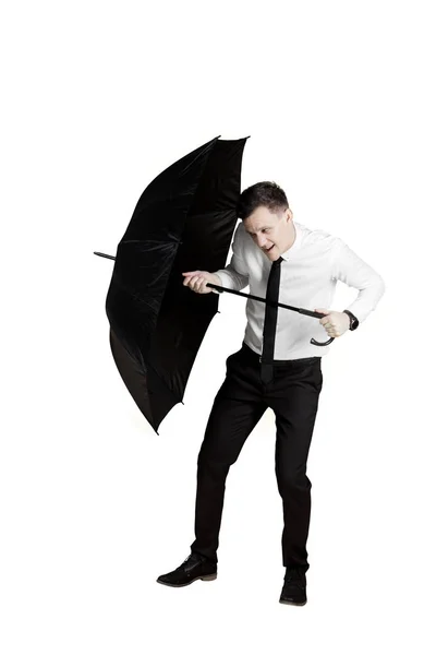 Zakenman beschermt zichzelf met een paraplu — Stockfoto