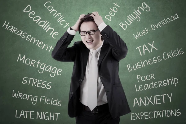 Young entrepreneur thinking his problems — Stock Photo, Image