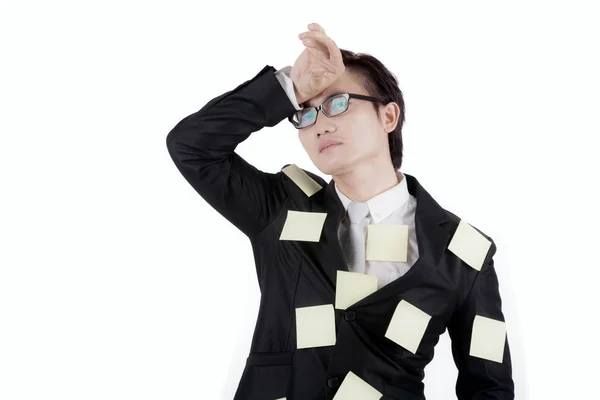 Asian businessman with sticky notes on studio — Stock Photo, Image