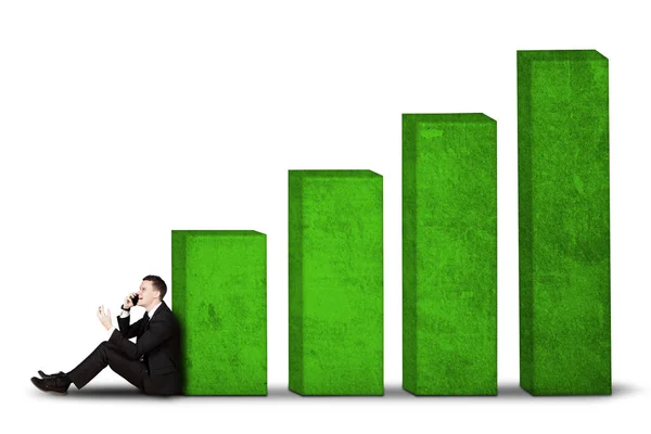 Male manager sitting with growth business chart — Stock Photo, Image