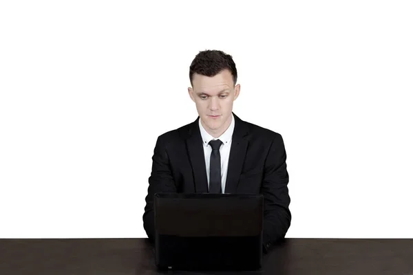 Caucasian businessman with laptop on desk — Stock Photo, Image