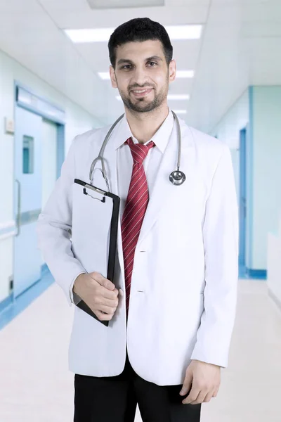 Arabian doctor with clipboard in the hospital — Stock Photo, Image