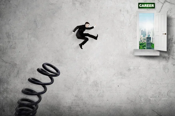 European businessman jumping toward career word — Stock Photo, Image