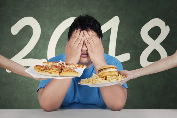 Fat man with number 2018 — Stock Photo, Image