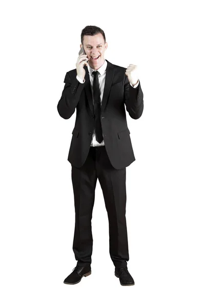 Uomo d'affari di successo utilizzando un telefono cellulare — Foto Stock