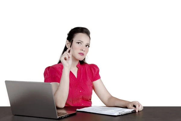 Caucasian businesswoman looks pensive on studio — Stock Photo, Image