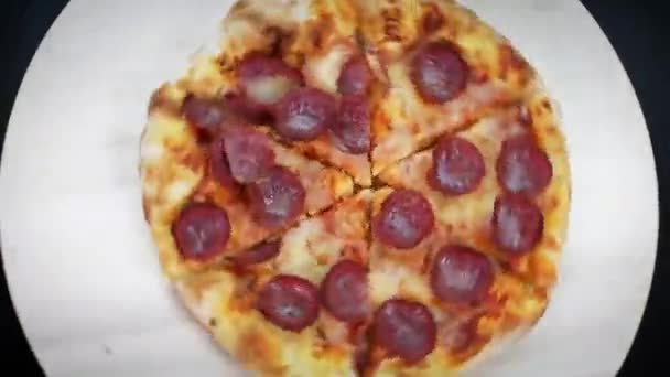 Close Hands Taking Slices Pepperoni Pizza Wooden Plate Spinning Table — Stock Video