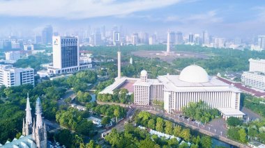 Beautiful Istiqlal mosque with office building clipart