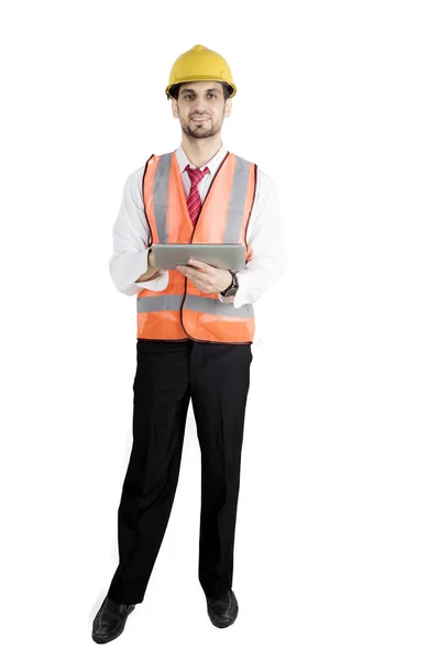 Young foreman holds a tablet on studio — Stock Photo, Image