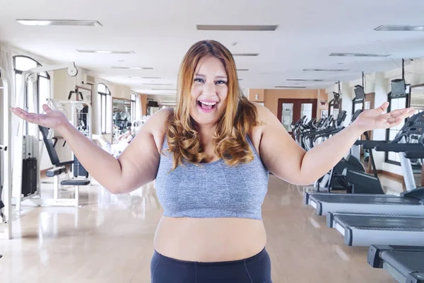 Obese woman looks happy at gym center — Stock Photo, Image