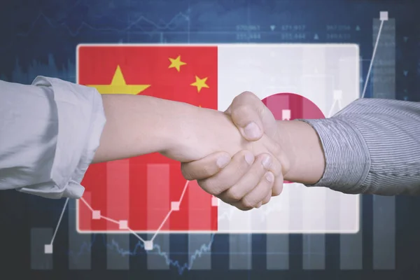 Business-avtal med Japan och Kina flagga — Stockfoto