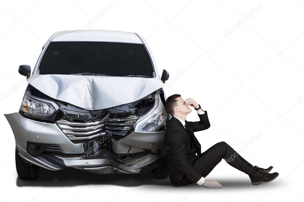 Caucasian businessman with broken car