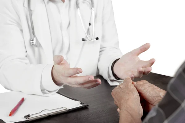 Male doctor discussing with his elderly patient — Stock Photo, Image