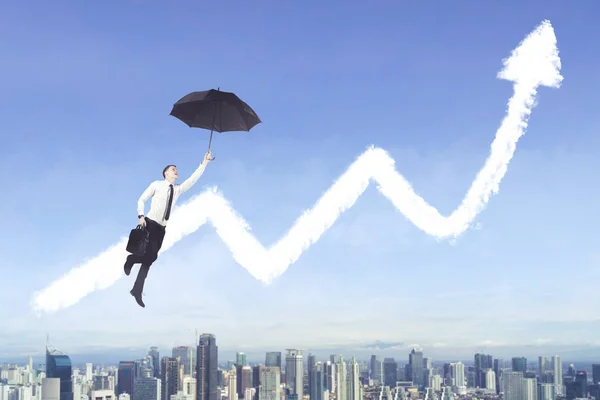 Amerikaans zakenman met paraplu en groei grafiek — Stockfoto