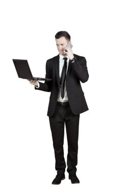 Smartphone ve laptop ile ABD'li iş adamı