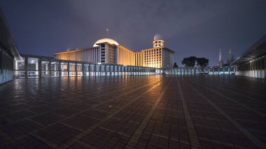 Beautiful Istiqlal mosque with light at night clipart