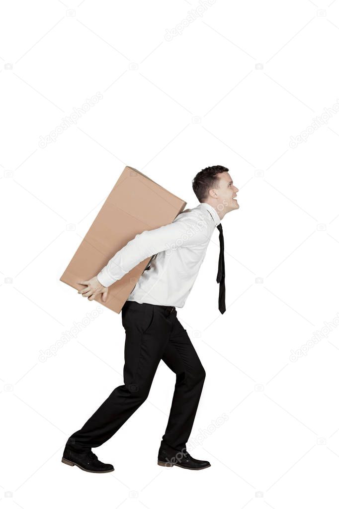 American businessman carrying a box on studio