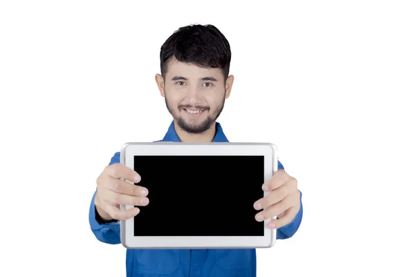 Young friendly mechanic holding digital tablet — Stock Photo, Image