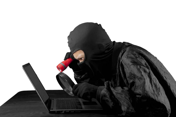 Hacker using flash light and magnifying glass. — Stock Photo, Image