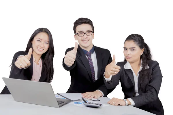 Asian business people showing thumbs up in meeting — Stock Photo, Image