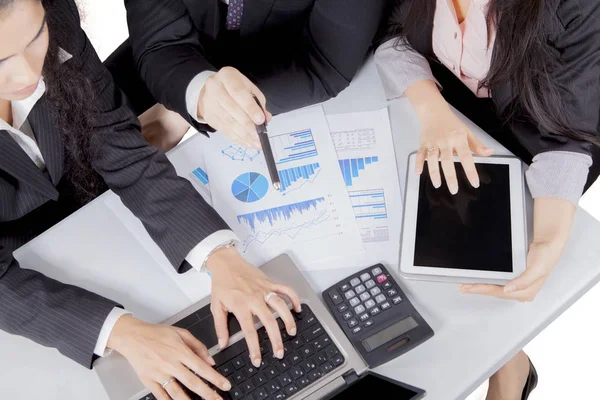 Close up of business people desk in meeting — Stock Photo, Image