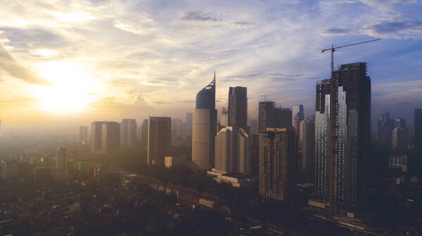 JAKARTA, Indonesia. Jan 12, 2018: Aerial view of gorgeous Jakarta cityscape at sunrise.