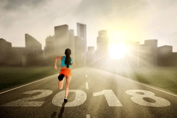 Asian woman running on the road — Stock Photo, Image