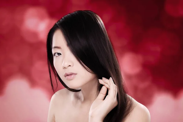 Beautiful oriental woman with shiny black hair