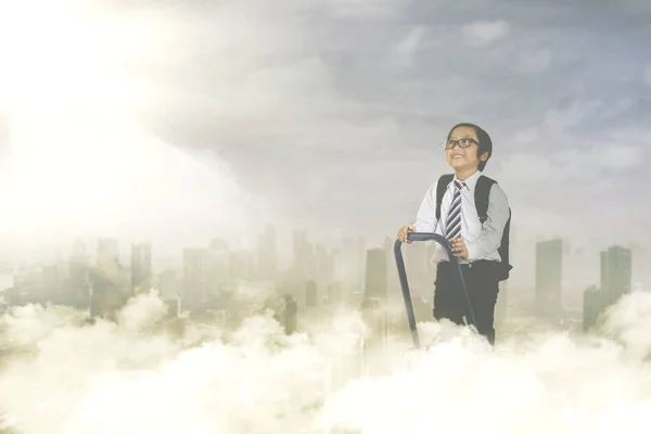 Little boy with ladder in the sky — Stock Photo, Image