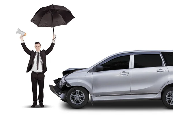 Insurance concept: businessman with crashed car — Stock Photo, Image