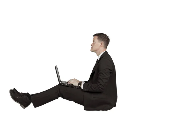 European businessman using a laptop on studio — Stock Photo, Image