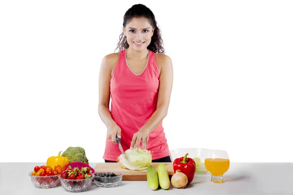 African girl preparing healthy salad on studio — Stock Photo, Image