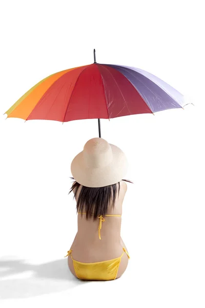 Female tourist with swimsuit and umbrella — Stock Photo, Image