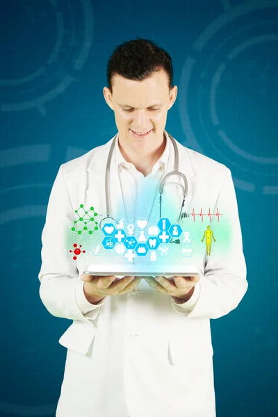Male doctor showing medical symbols — Stock Photo, Image