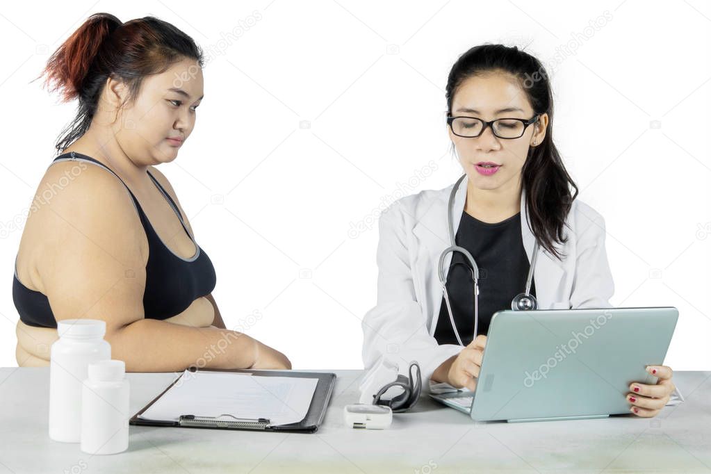 Female doctor explaining the medical report on studio