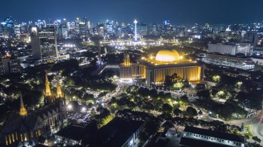 Beautiful Jakarta city with glowing skyscraper at night clipart