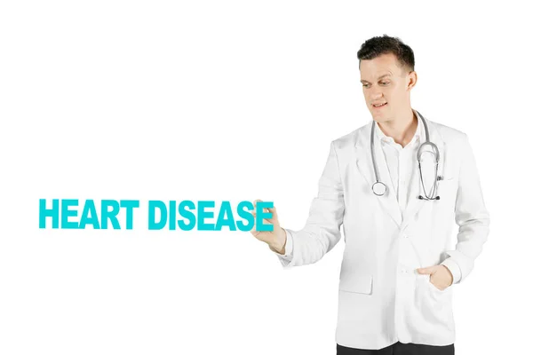 Caucasian male physician writing heart disease text — Stock Photo, Image