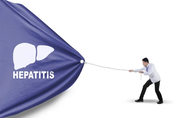 Asian physician pulling a banner with hepatitis word — Stock Photo, Image