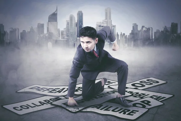 Young businessman hitting his problems — Stock Photo, Image