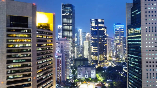 View of apartment and office buildings at night — Stock Photo, Image