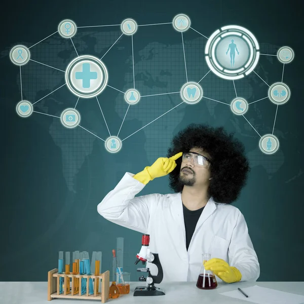 African scientist with virtual screen background — Stock Photo, Image