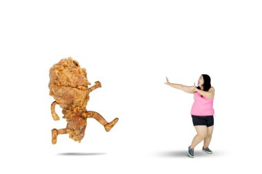 Obese woman running away from a fried chicken clipart