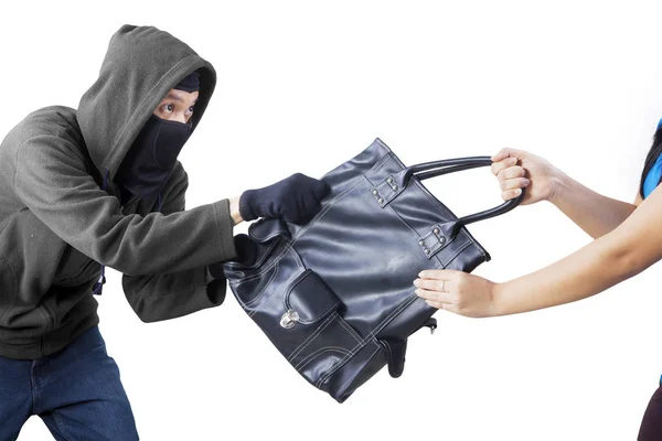 Robber trying to snatch a handbag from his victim — Stock Photo, Image