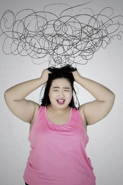 Fat woman frustrated with chaos sign — Stock Photo, Image