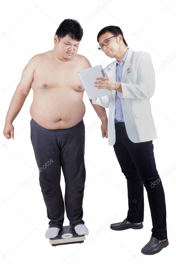 Male doctor showing medical result to his patient