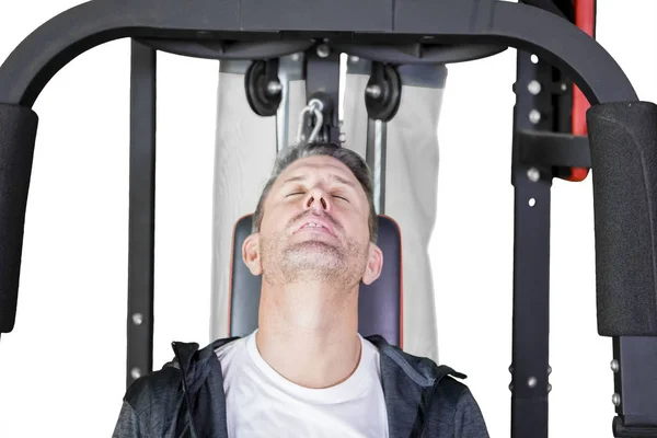 Homme caucasien regarde endormi sur la machine d'exercice — Photo