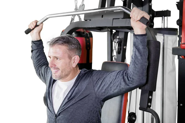 Young handsome man practicing weight lifting — ストック写真