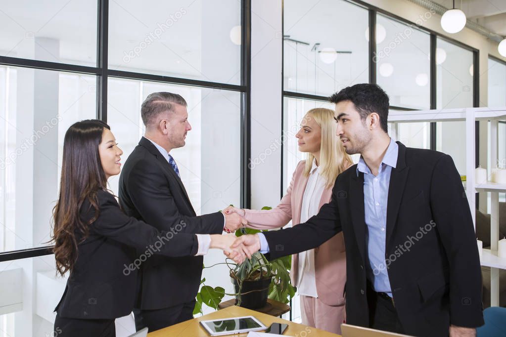 Multiethnic business people shaking hands