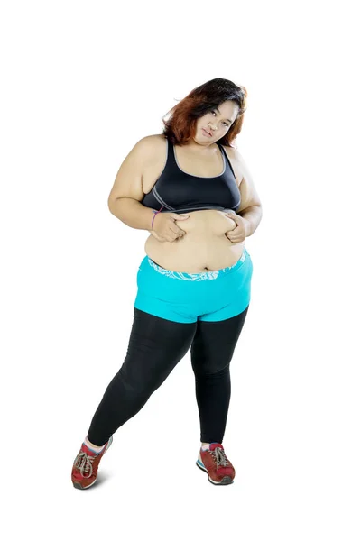 Gros asiatique femme pincer son ventre — Photo